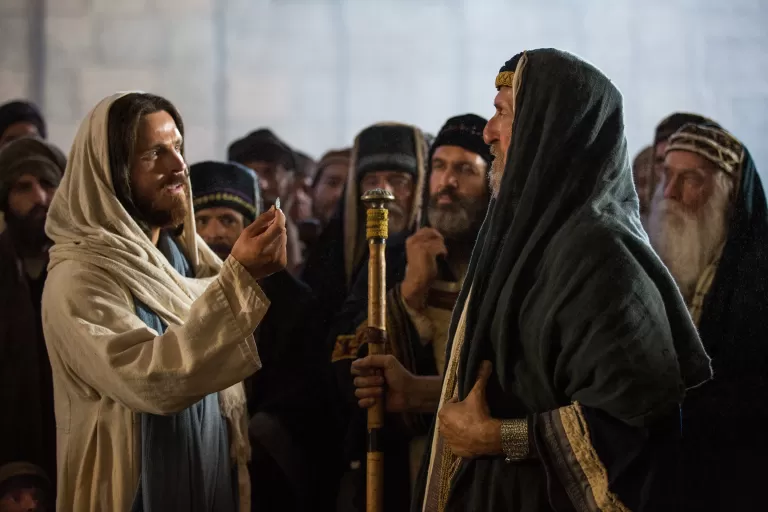 Jesus telling the Pharisees to “render to Caesar the things that are Caesar’s, and to God the things that are God’s.”