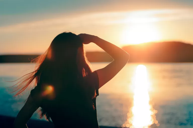 Woman watching a sunrise
