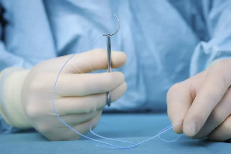 Doctor Preparing to Stitch